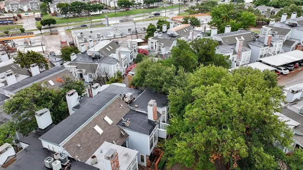 an aerial view of a city with lots of residential buildings