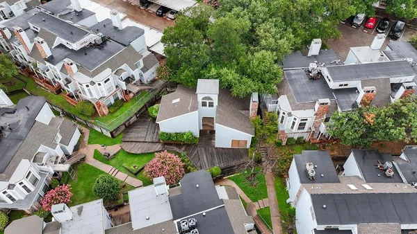 an aerial view of a house with outdoor space
