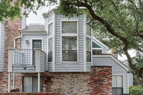 a view of a house with a tree