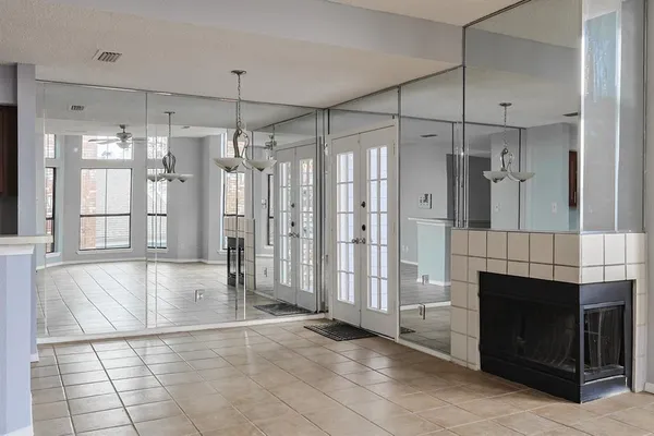 a view of a livingroom with a fireplace and window