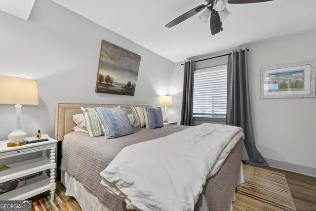 a bed room with a bed and a lamp