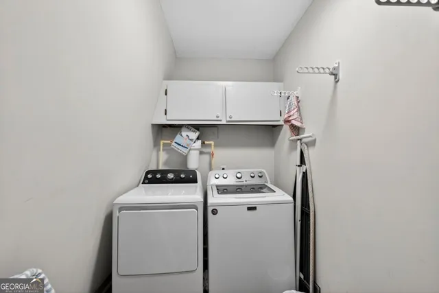 a utility room with dryer and washer