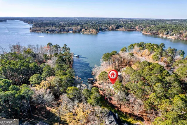 an aerial view of a houses with swimming pool and outdoor space