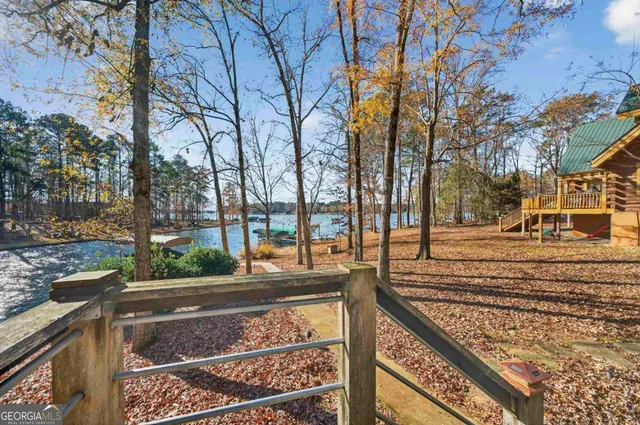 a large tree in the middle of a yard