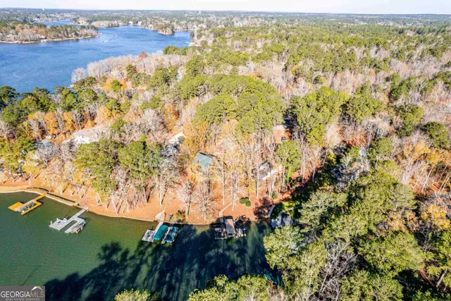 an aerial view of a houses with ocean view