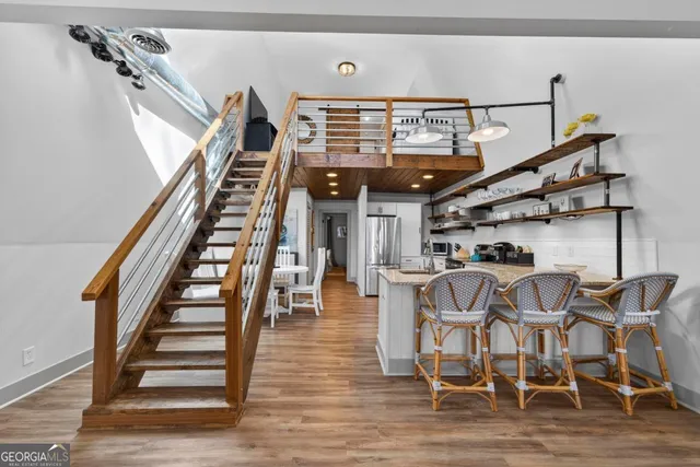 a view of entryway and hall with wooden floor