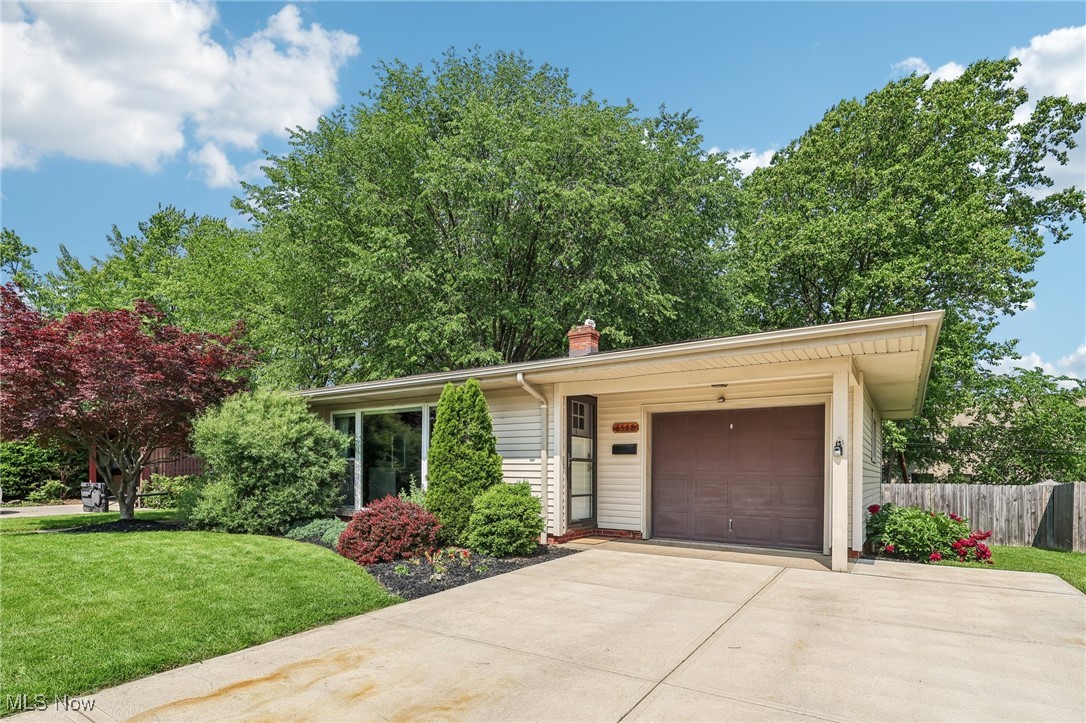6568 Sherborn Road Parma Heights, OH 44130 - Photo 2 of 47 Ranch-style home featuring concrete driveway, a garage, and a chimney