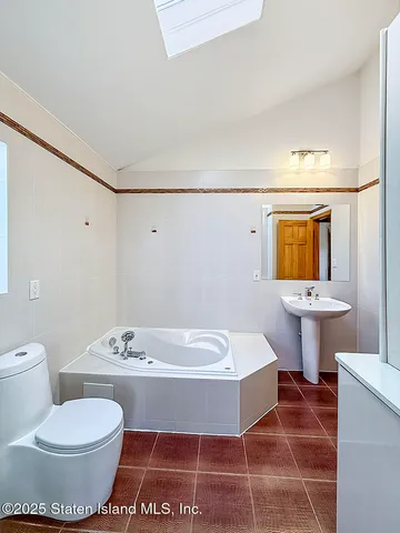 a bathroom with a sink a toilet and a bathtub