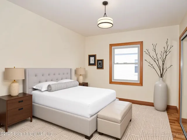 a spacious bedroom with a bed and a couch