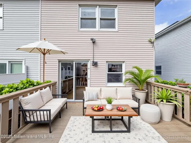 a outdoor space with patio furniture and potted plants