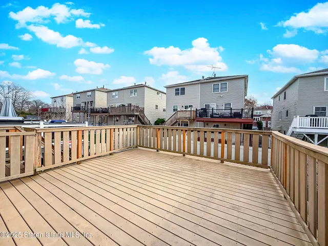a view of a balcony with wooden floor
