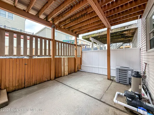 a view of a room with wooden walls