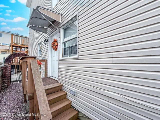 a view of a patio with wooden cabinets