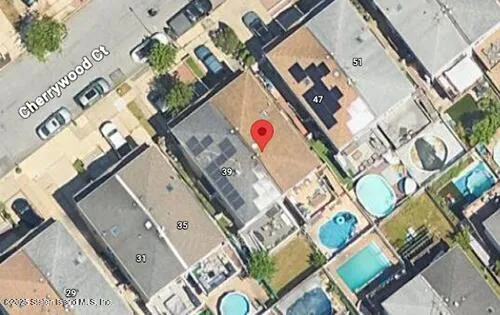 an aerial view of a red and white building with a outdoor space