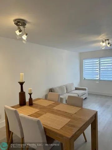 a bedroom with a table and chairs