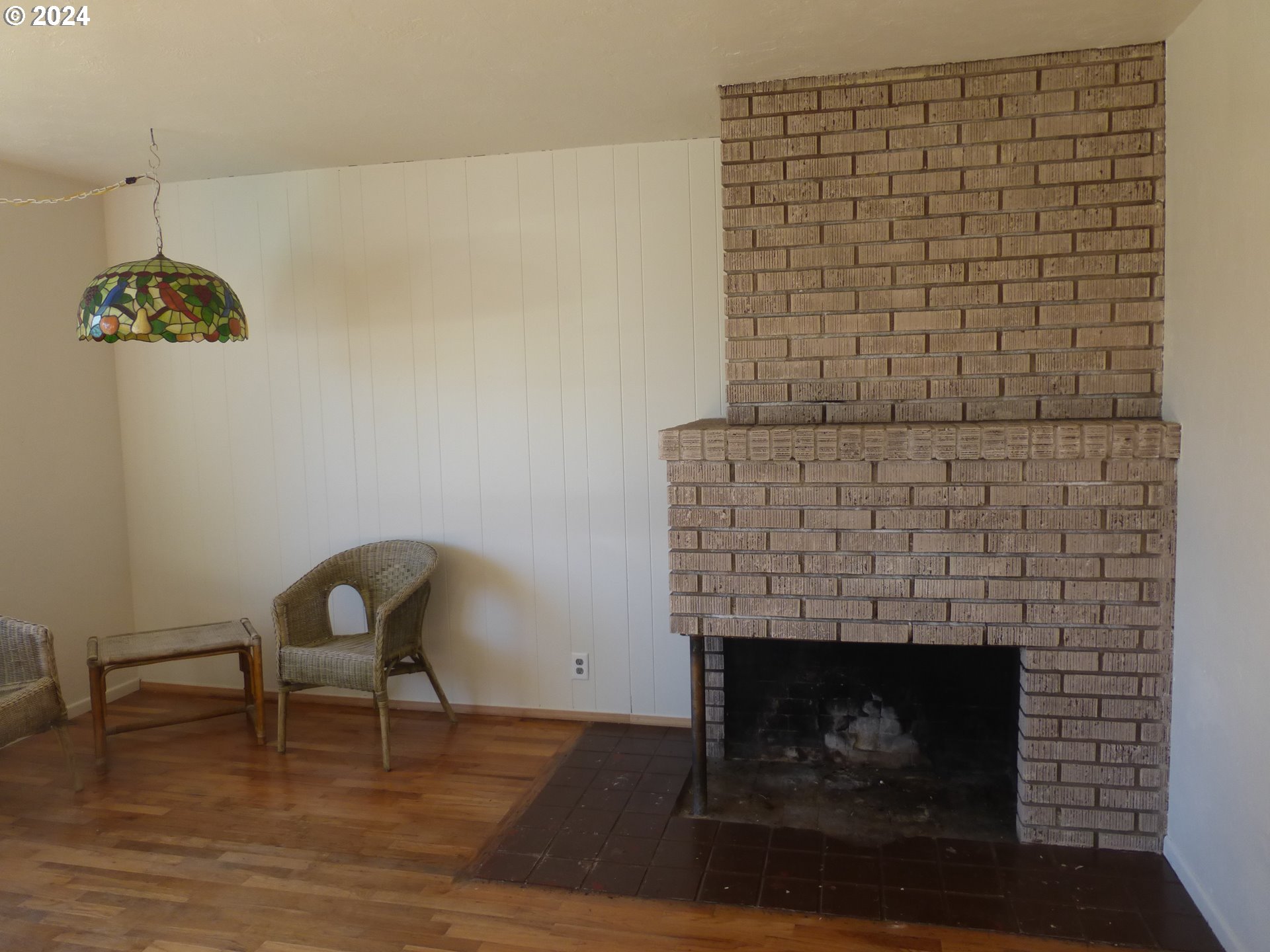 1816 Carter Lane Springfield, OR 97477 - Photo 8 of 35 a room with a fireplace and a dining table