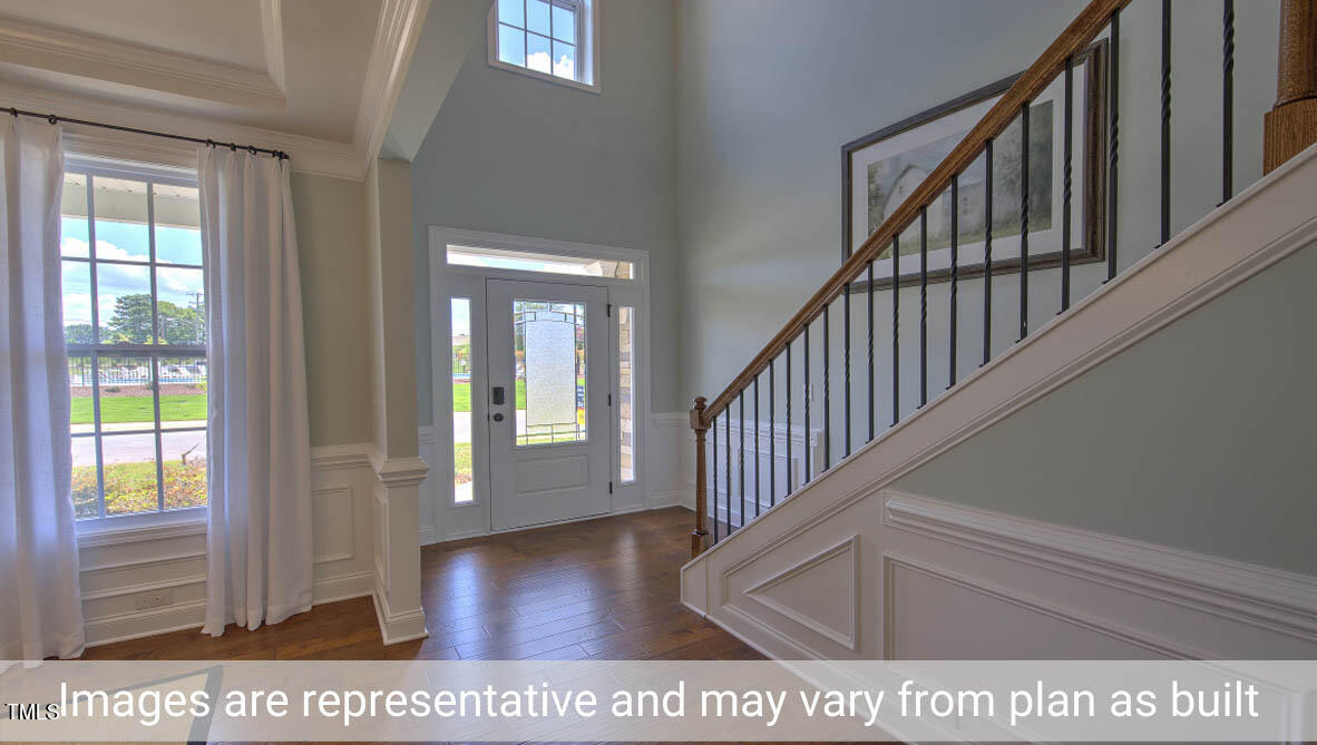 1857 Old Fields Boulevard Haw River, NC 27258 - Photo 3 of 53 a view of staircase with wooden floor and windows