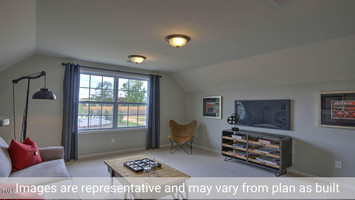 1857 Old Fields Boulevard Haw River, NC 27258 - Photo 38 of 53 a living room with furniture and a flat screen tv