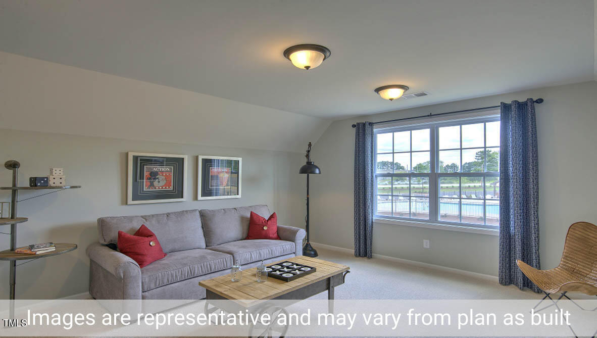 1857 Old Fields Boulevard Haw River, NC 27258 - Photo 39 of 53 a living room with furniture and a window