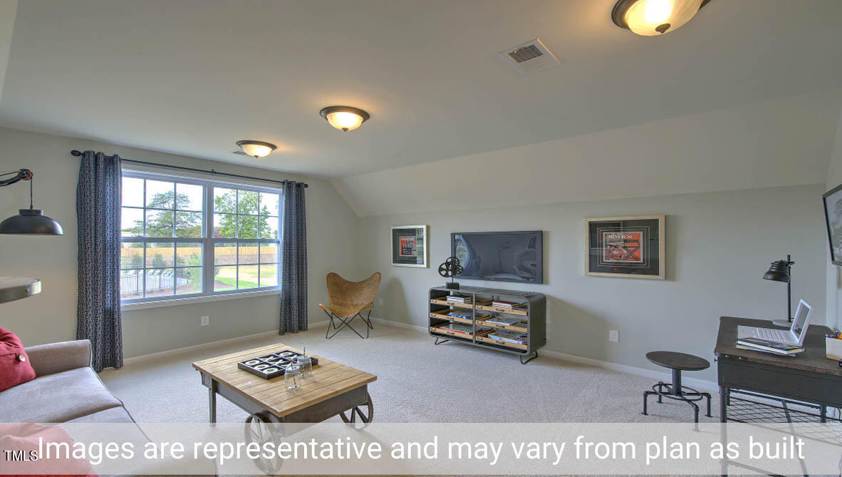 1857 Old Fields Boulevard Haw River, NC 27258 - Photo 43 of 53 a living room with furniture a rug and a window