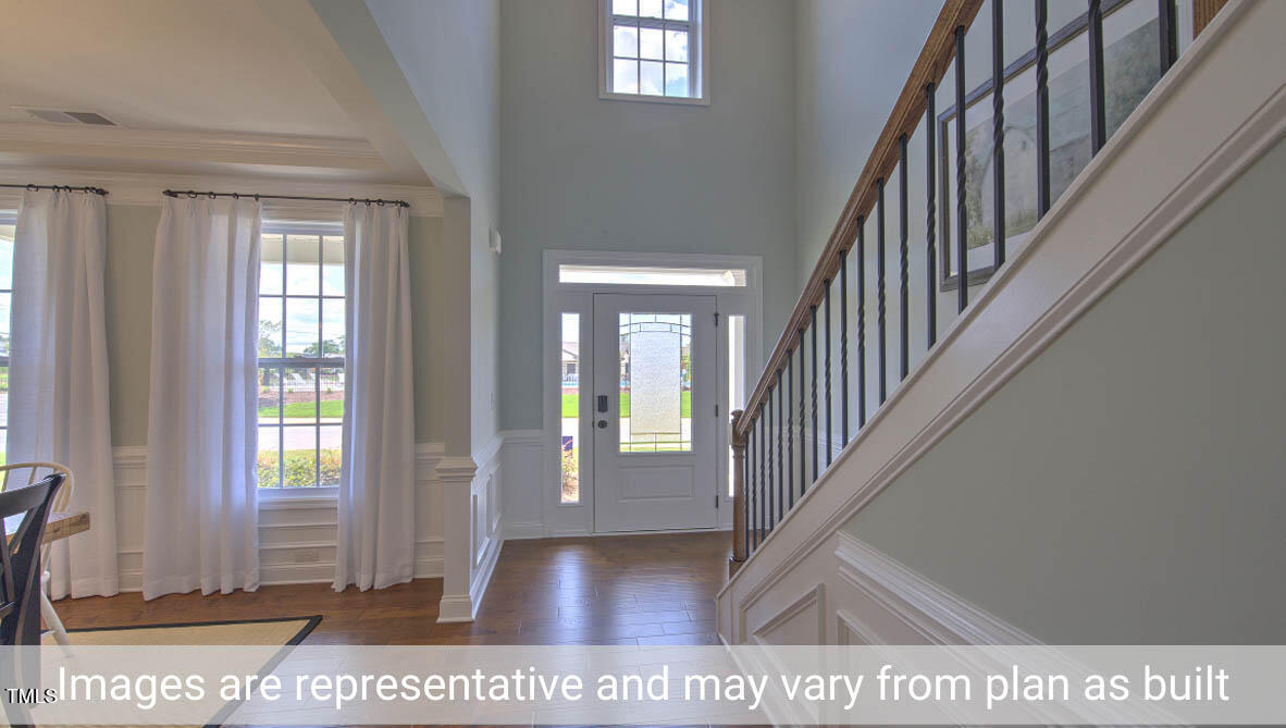 1857 Old Fields Boulevard Haw River, NC 27258 - Photo 6 of 53 a view interior of a house with wooden floor windows and entryway