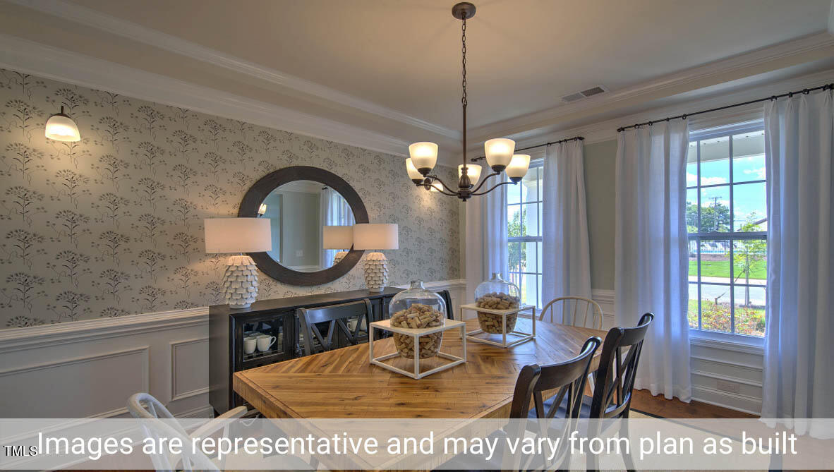 1857 Old Fields Boulevard Haw River, NC 27258 - Photo 8 of 53 a view of a dining room with furniture window and outside view