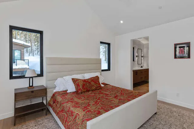 a bedroom with bed and window