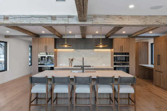 a kitchen with a table and chairs