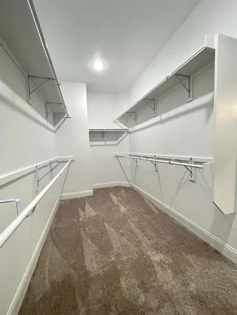 a view of a room with racks on the wall
