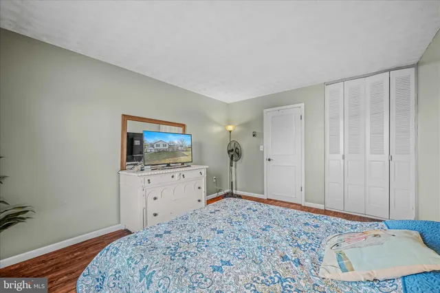 a bedroom with a bed and hallway