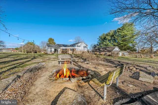 a view of a backyard patio and swimming pool