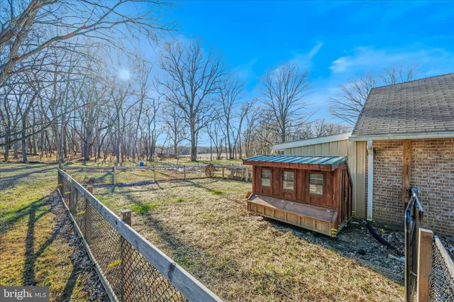 a view of a backyard with sitting area