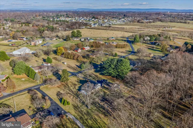 a view of house with a yard