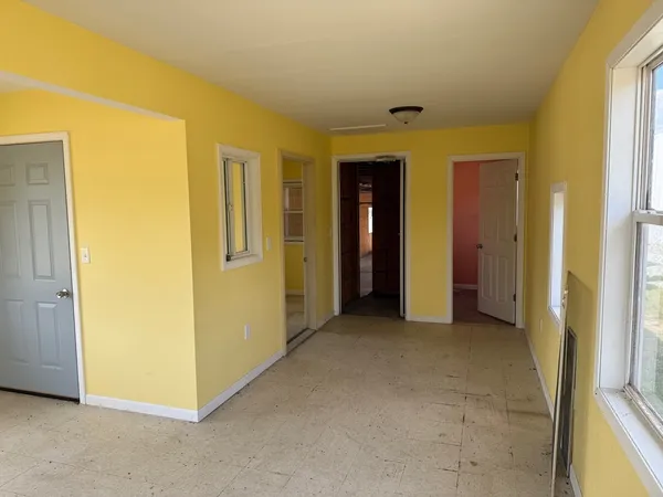 a view of a hallway with closet
