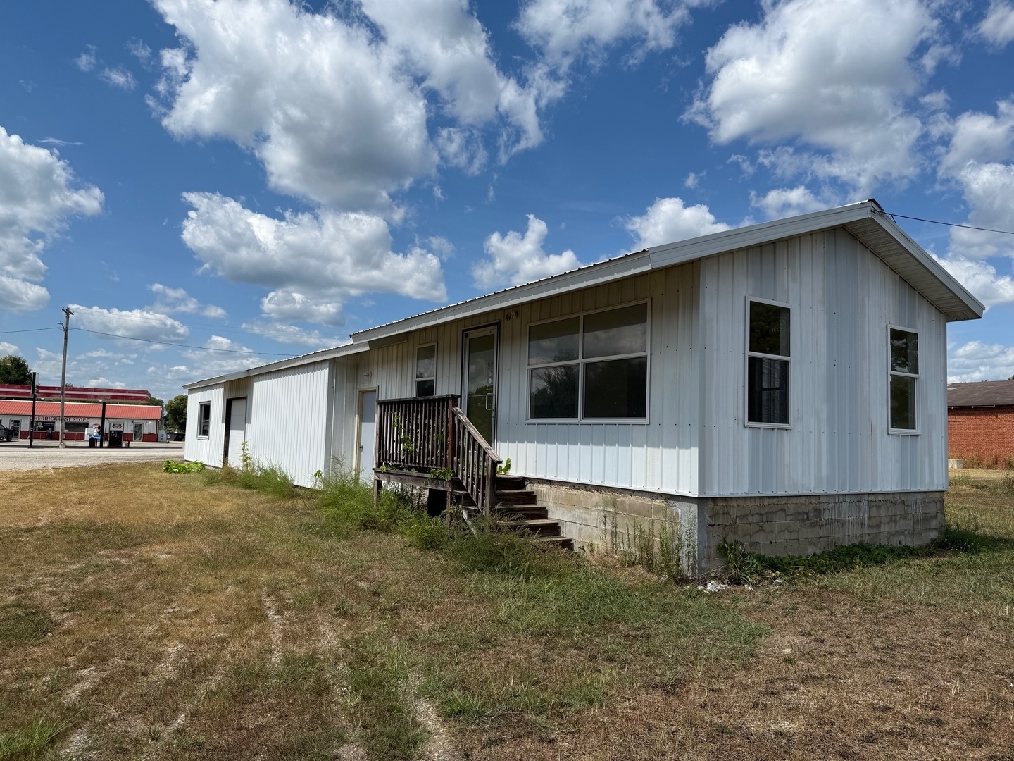 18 Broadway Street Herrick, IL 62431 - Photo 2 of 16 a view of a house with backyard and entertaining space