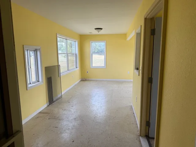 a view of hallway with windows