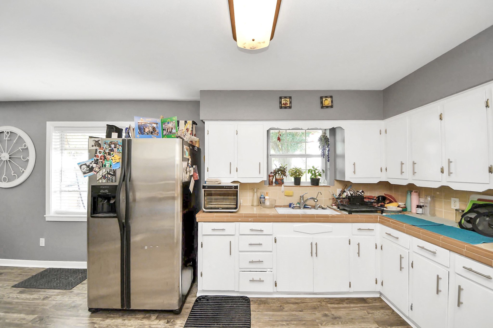 2990 FM 1163 Road El Campo, TX 77437 - Photo 26 of 50 a kitchen with granite countertop a refrigerator and a stove top oven