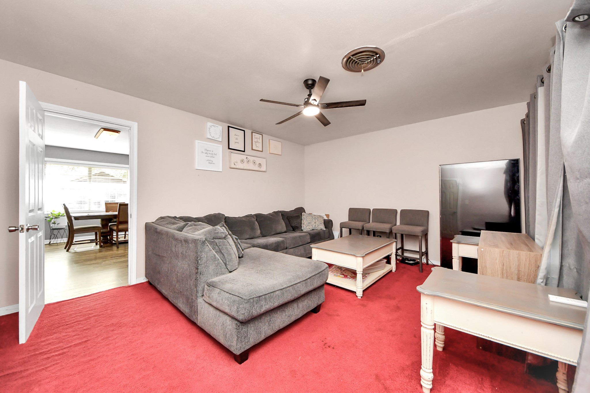 2990 FM 1163 Road El Campo, TX 77437 - Photo 30 of 50 a living room with furniture and a flat screen tv