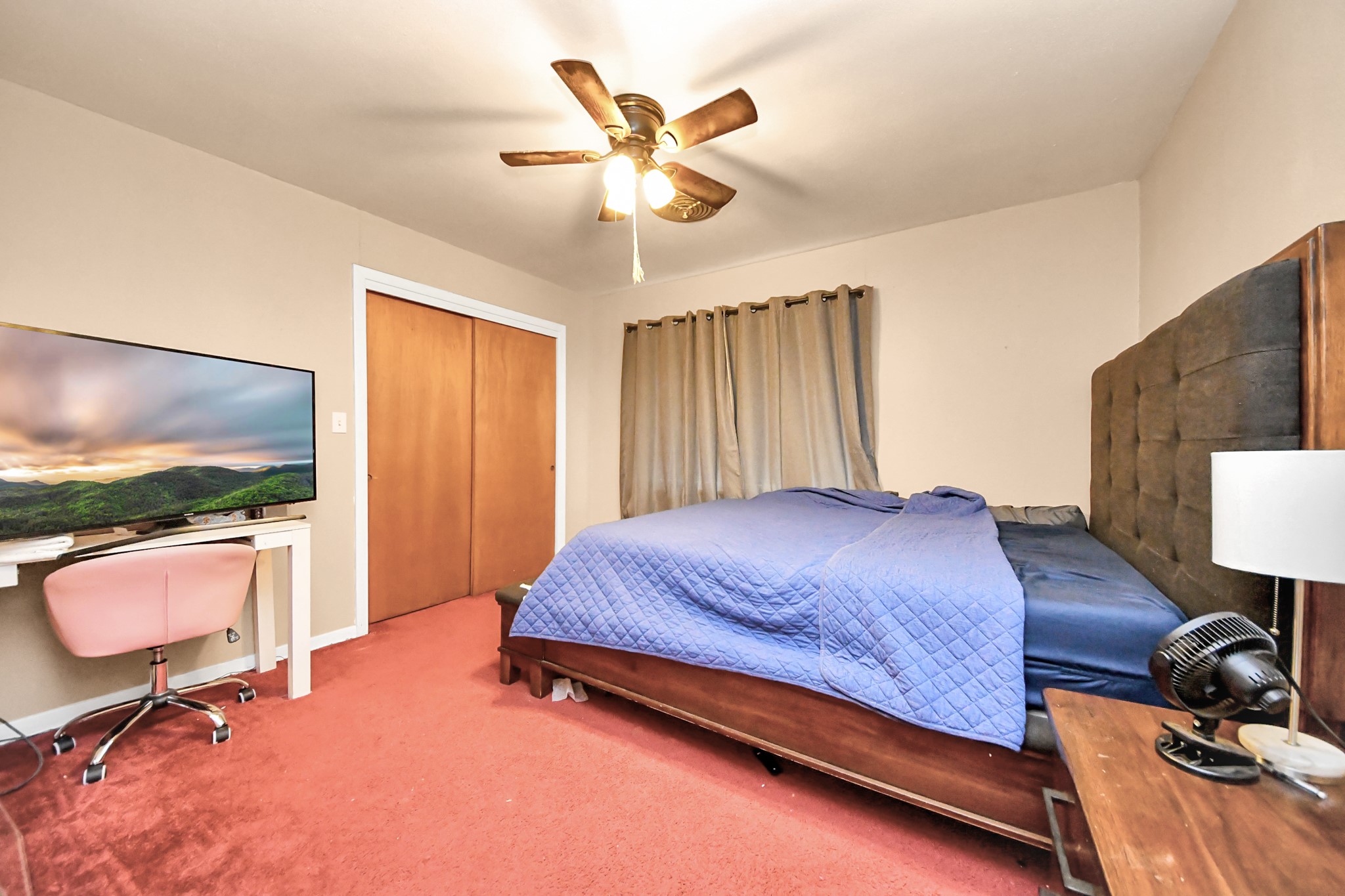 2990 FM 1163 Road El Campo, TX 77437 - Photo 35 of 50 a bedroom with a bed and a chandelier