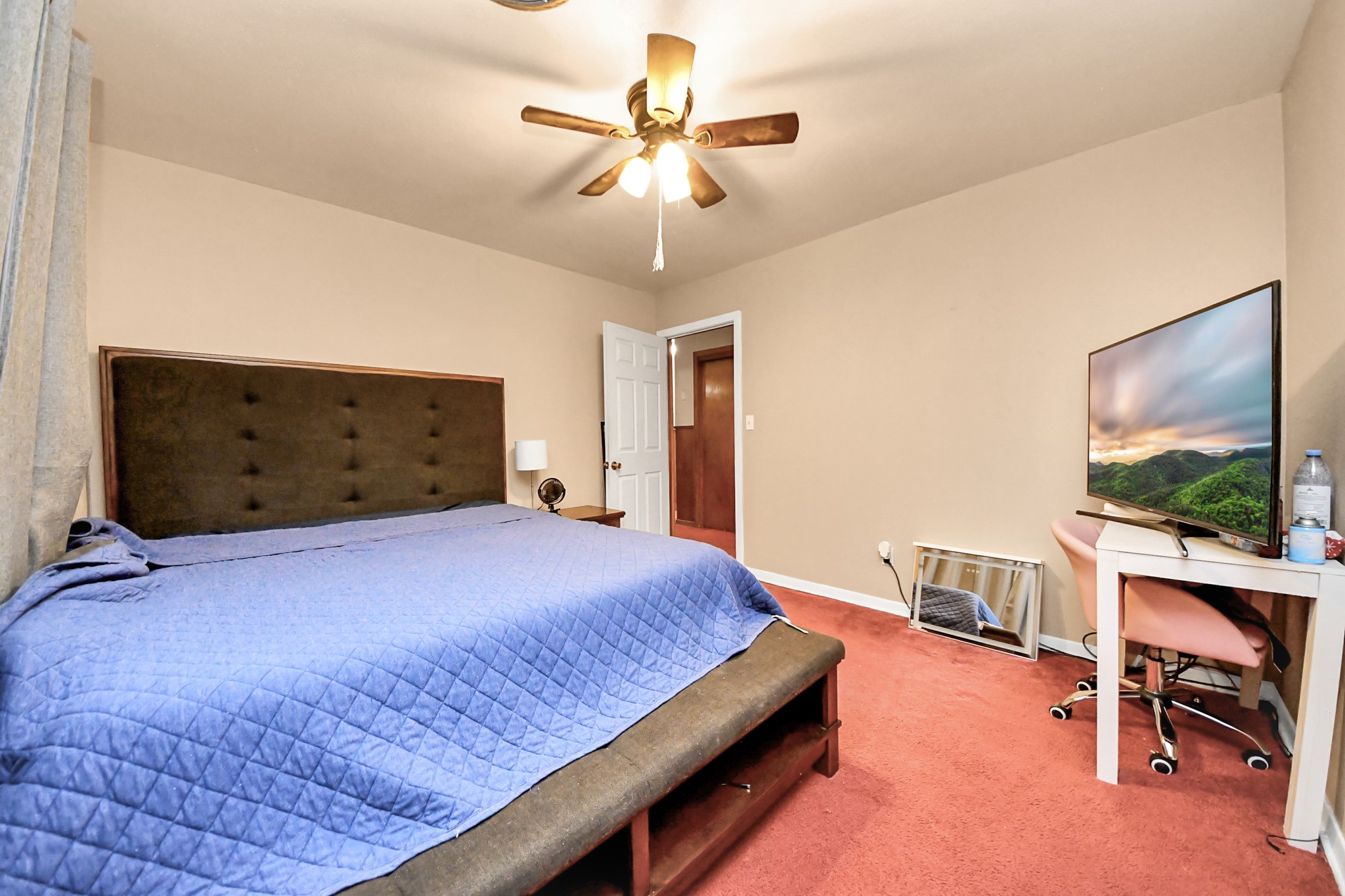 2990 FM 1163 Road El Campo, TX 77437 - Photo 36 of 50 a bedroom with a bed and a chandelier