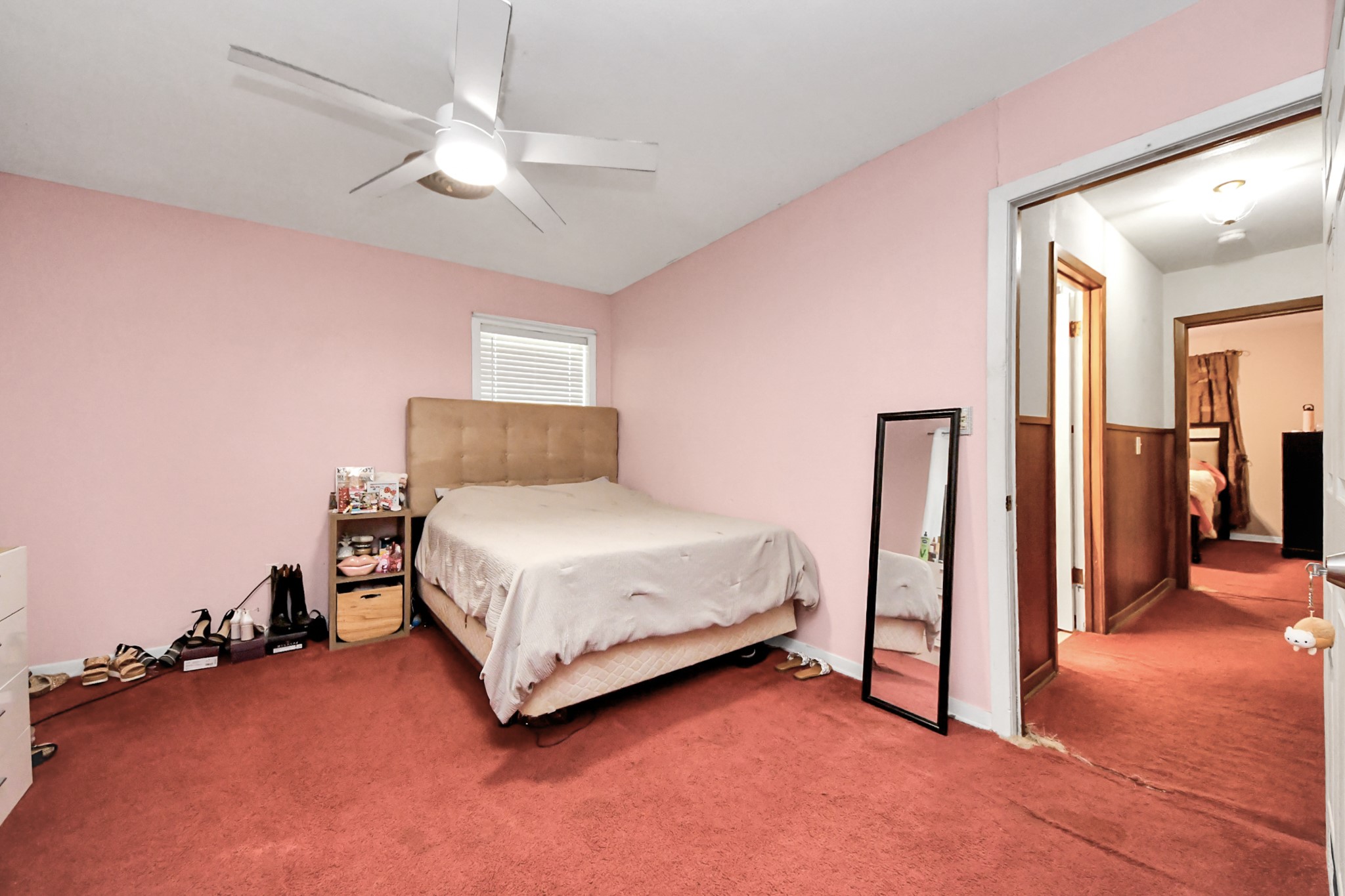 2990 FM 1163 Road El Campo, TX 77437 - Photo 37 of 50 a bedroom with a bed and a chandelier