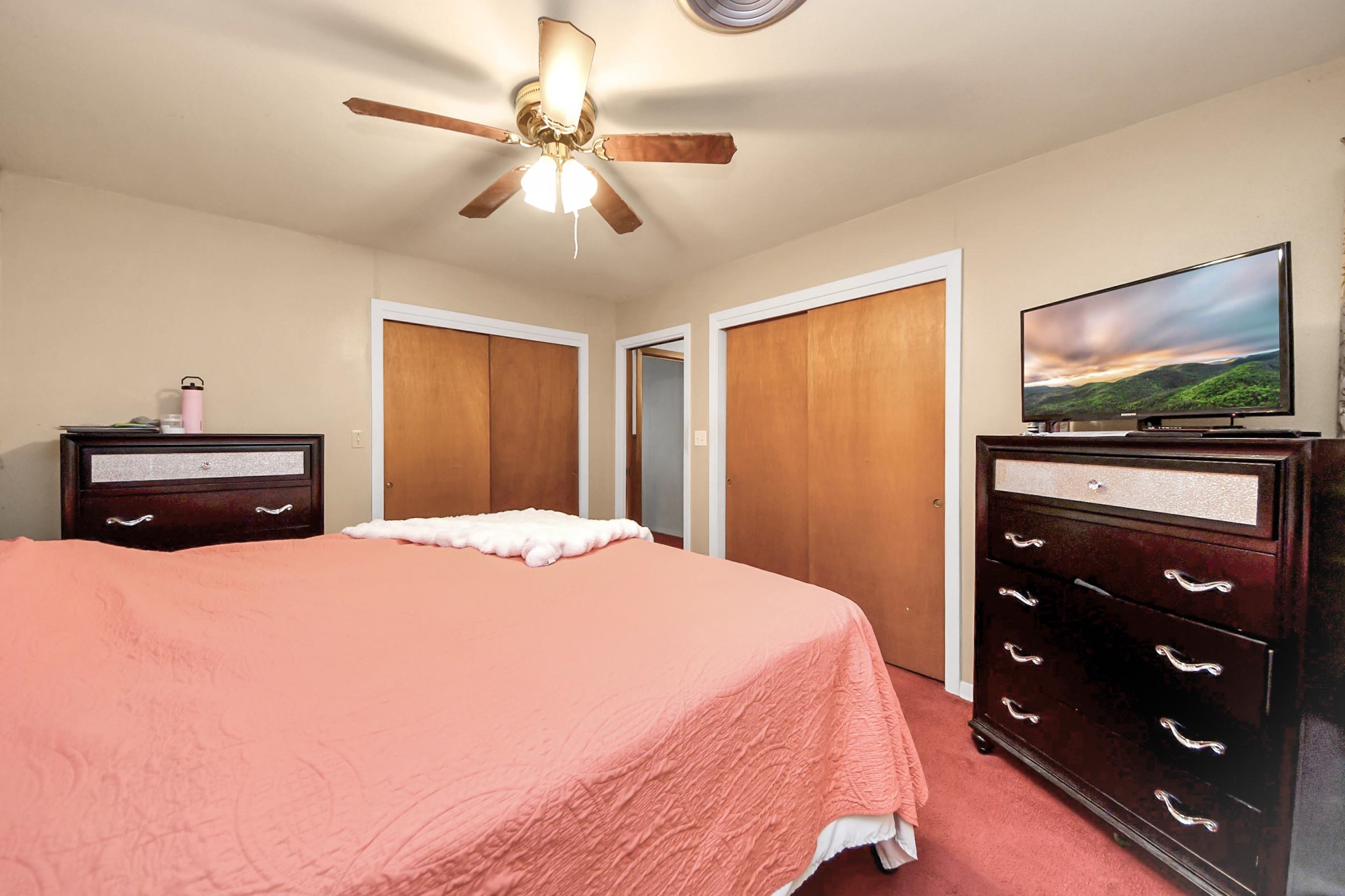 2990 FM 1163 Road El Campo, TX 77437 - Photo 43 of 50 a bedroom with a bed and a flat tv screen on dresser