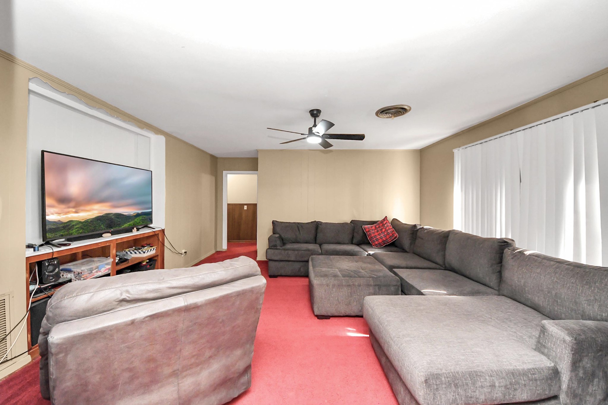 2990 FM 1163 Road El Campo, TX 77437 - Photo 46 of 50 a living room with furniture and a flat screen tv