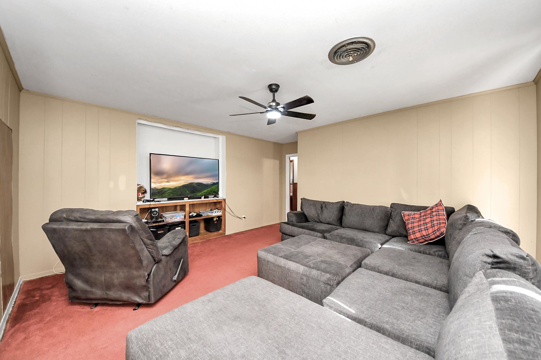 2990 FM 1163 Road El Campo, TX 77437 - Photo 47 of 50 a living room with furniture and a flat screen tv