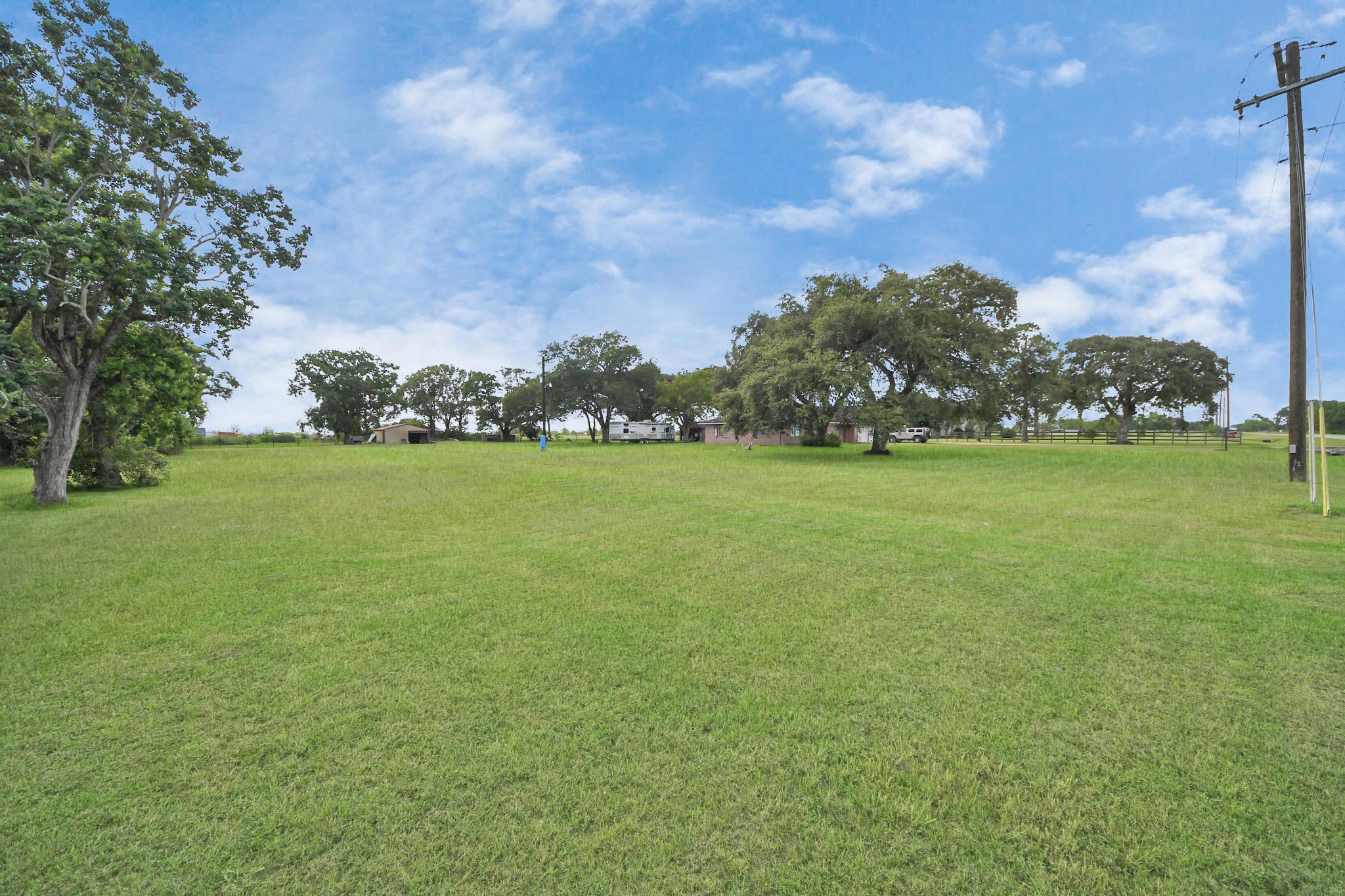 2990 FM 1163 Road El Campo, TX 77437 - Photo 8 of 50 a view of a green field with clear sky