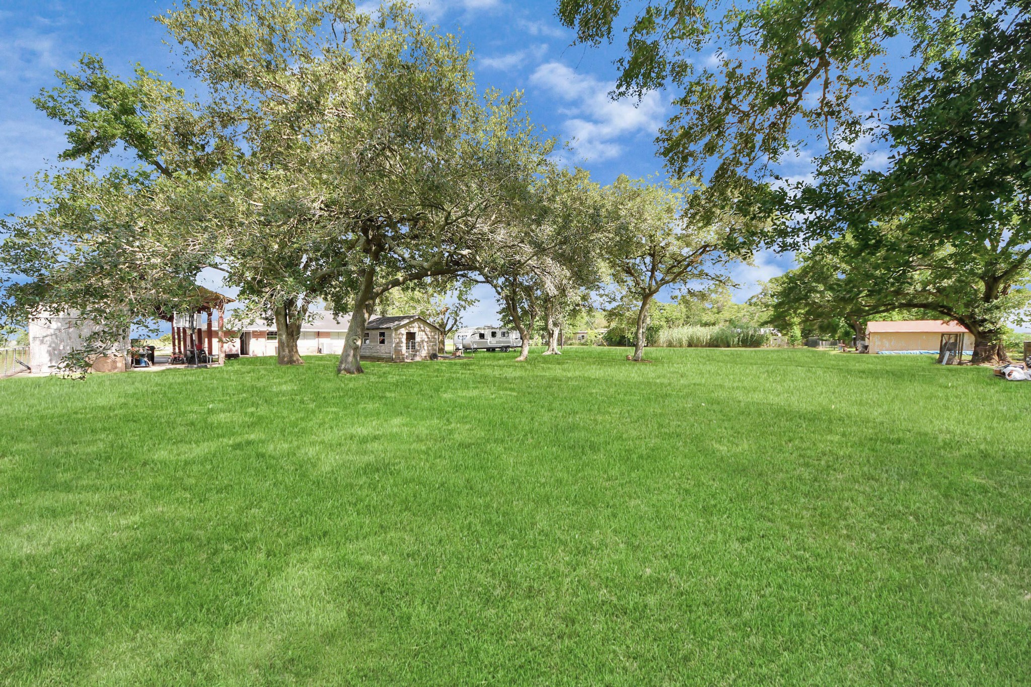 2990 FM 1163 Road El Campo, TX 77437 - Photo 10 of 50 a view of green field with trees