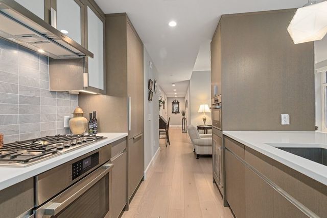 a view of a hallway with washer and dryer