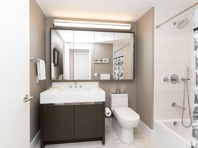 a lobby with furniture and a flat screen tv