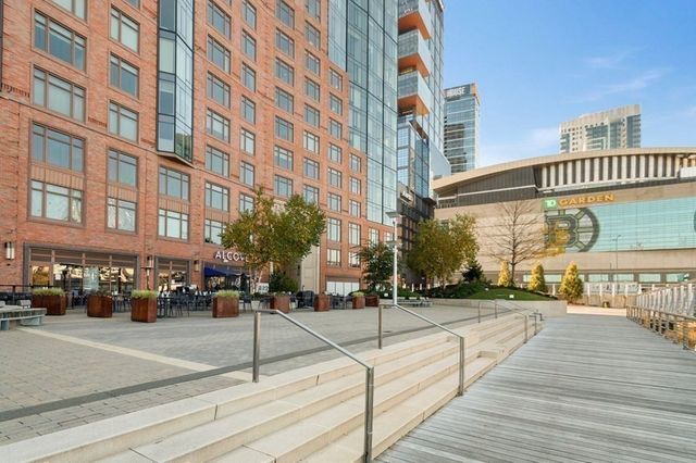 a bathroom with a sink mirror and vanity