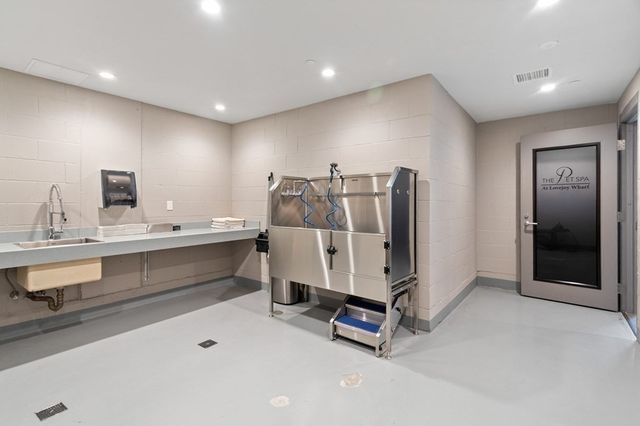 a view of a double vanity sink and living room